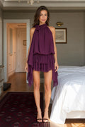 Woman wearing purple halter neck tiered mini dress front view