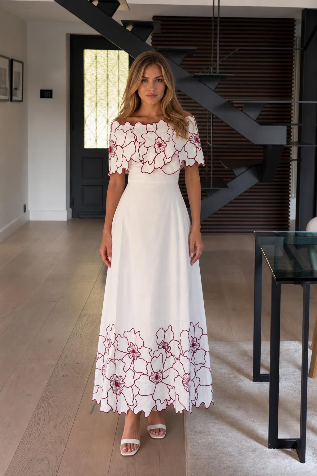 Front view of white off-the-shoulder floral embroidered maxi dress