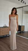 Front view of model wearing champagne sparkle knit maxi dress