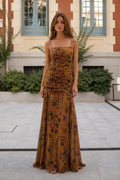 Front view of model wearing mustard floral ruched maxi dress