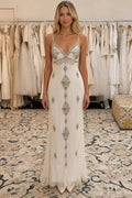 Front view of ivory embellished V-neck evening gown