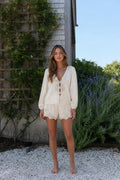 Front view of woman wearing cream lace trim lounge set