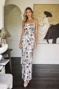 Front view of model wearing white floral beaded maxi dress