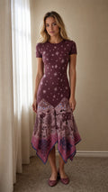 Front view of model wearing burgundy celestial star print midi dress