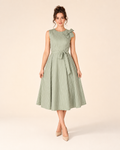 Front view of sage sleeveless striped midi dress with shoulder bow and tie waist