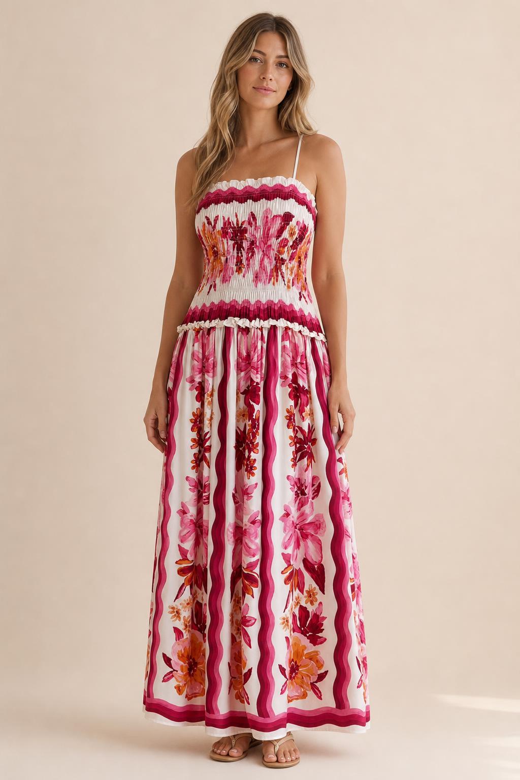 Front view of floral print smocked maxi dress in white