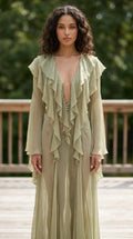 Model wearing sage green ethereal ruffle maxi dress from the front