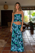 Front view of model wearing blue tropical print two-piece set
