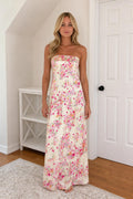 Front view of model wearing ivory floral strapless maxi dress