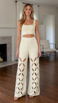 Front view of model wearing ivory knit cutout set