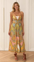 Front view of model wearing multi-color paisley tie-strap midi dress