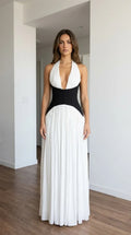 Front view of white halter pleated maxi dress