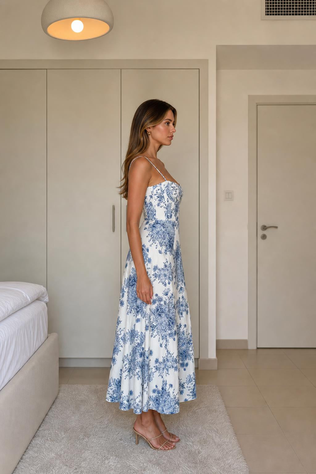 Side view of White & Blue floral midi dress