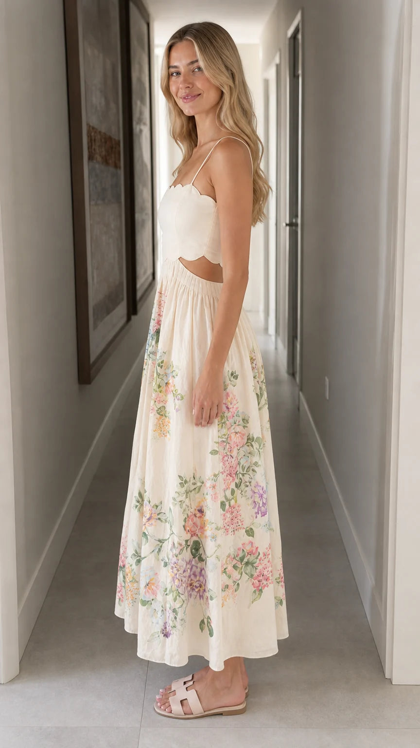 Woman wearing ivory floral cutout midi dress side view