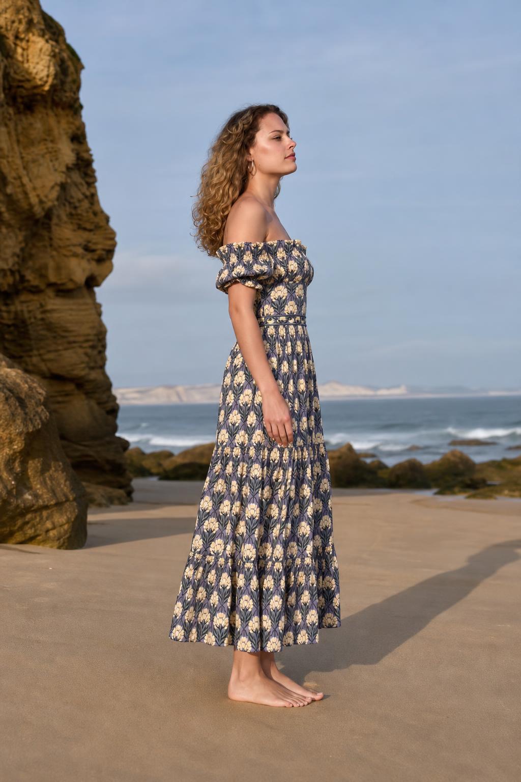 Side profile view of woman in blue floral midi dress