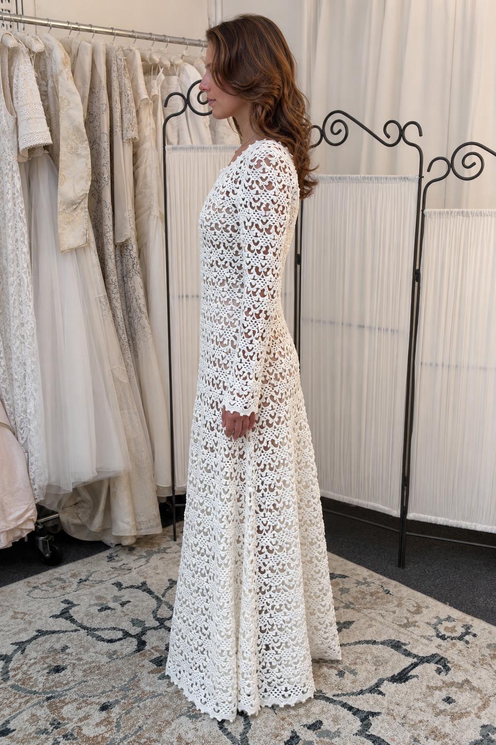 Side profile of woman wearing white crochet lace maxi dress