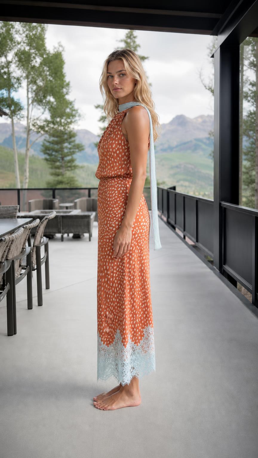 Side profile of rust orange printed maxi dress