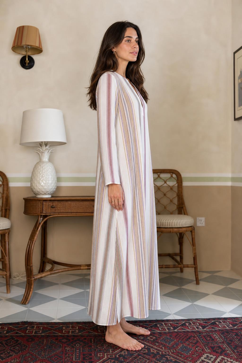 Side view of model wearing multi-stripe long sleeve maxi dress