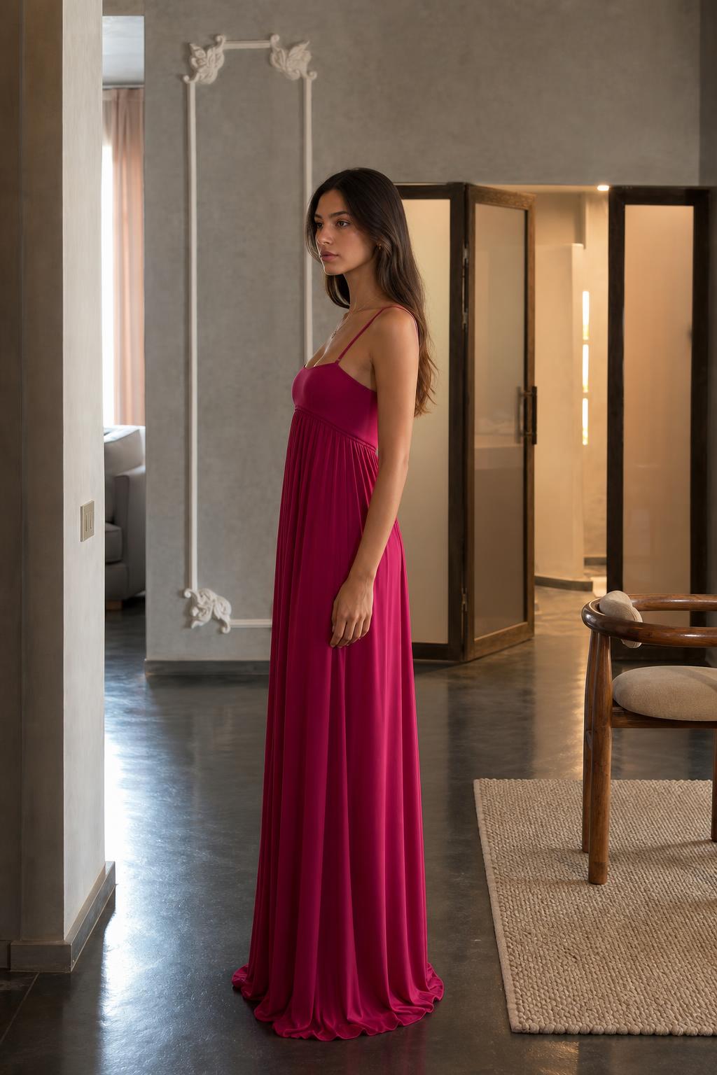 Side profile view of fuchsia maxi dress