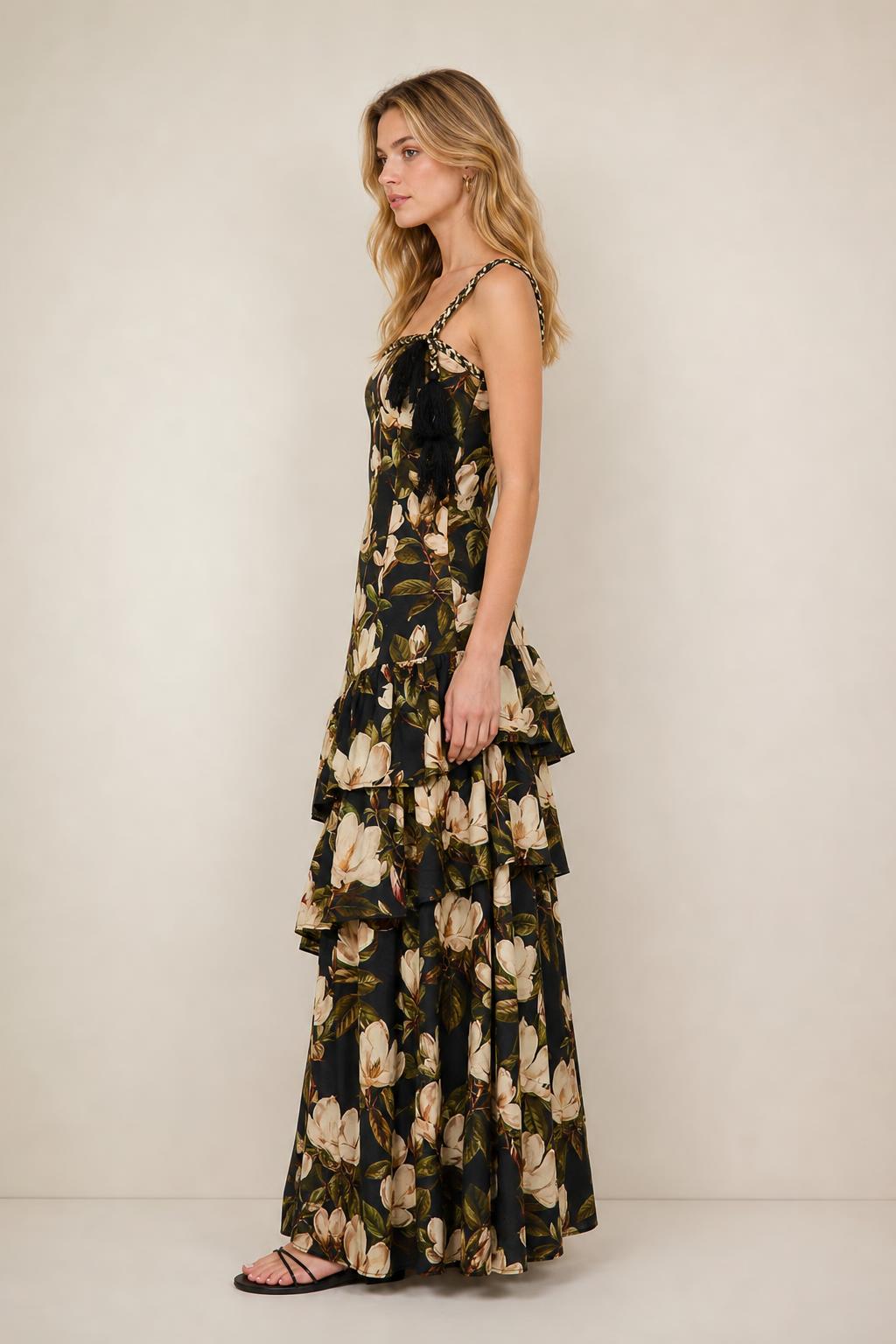 Side profile view of black floral maxi dress