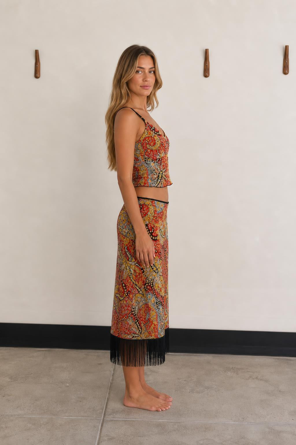 Side view of woman wearing Red Multi paisley two piece set