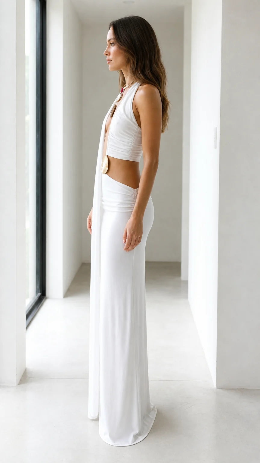 Side profile view of white drape maxi dress