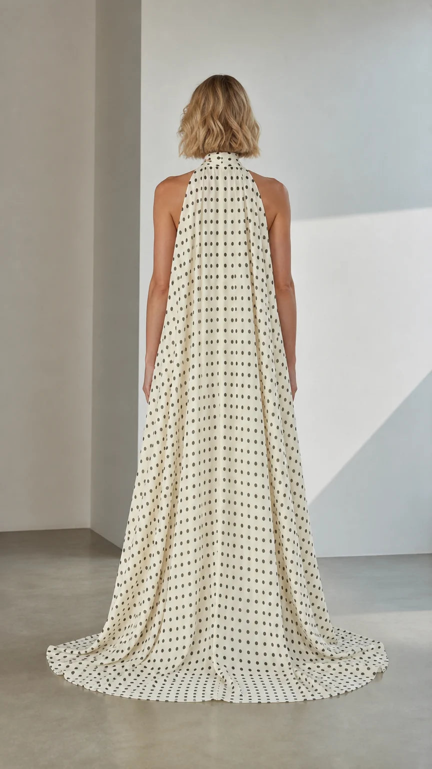 Back view of White Polka Dot Cape Evening Gown with sweeping train