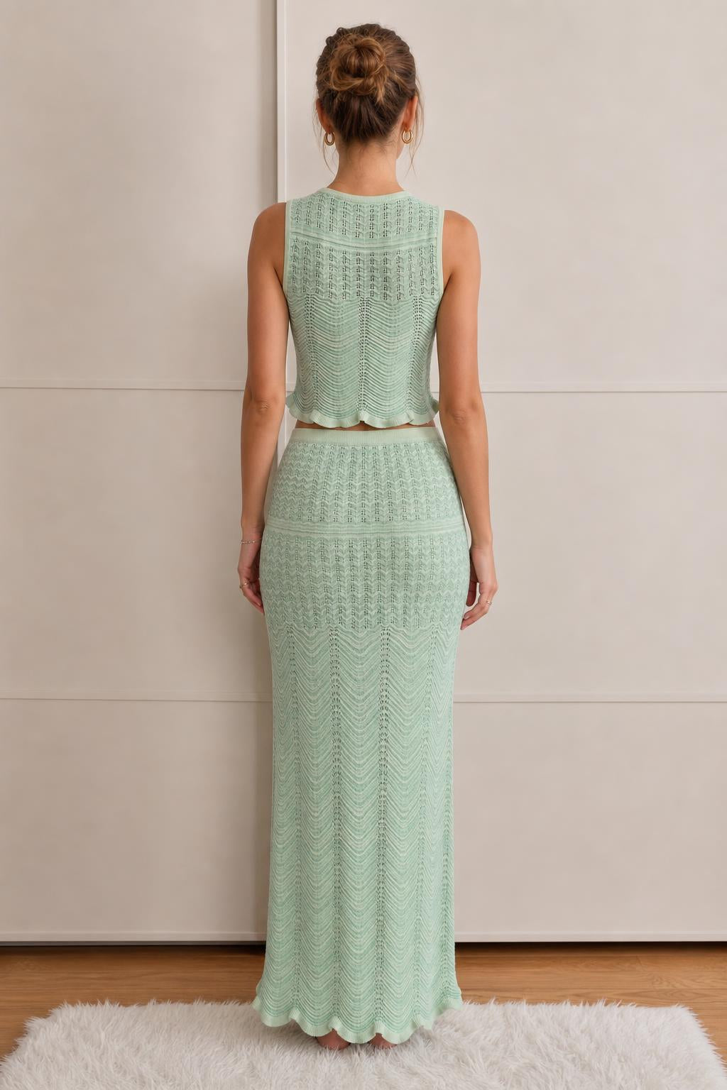 Model wearing mint green knit set, back view