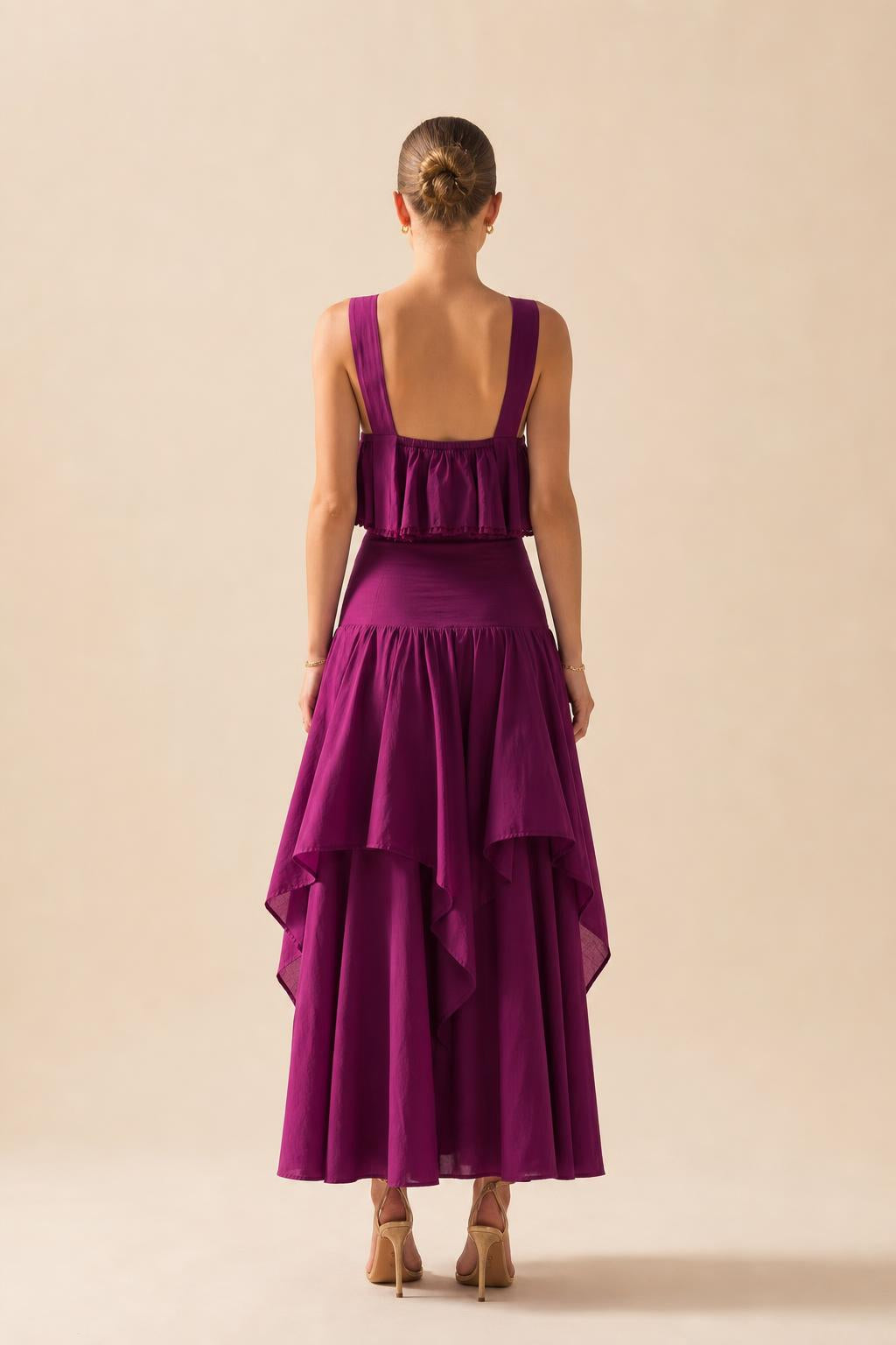 Back view of fuchsia tiered maxi dress showing strap details