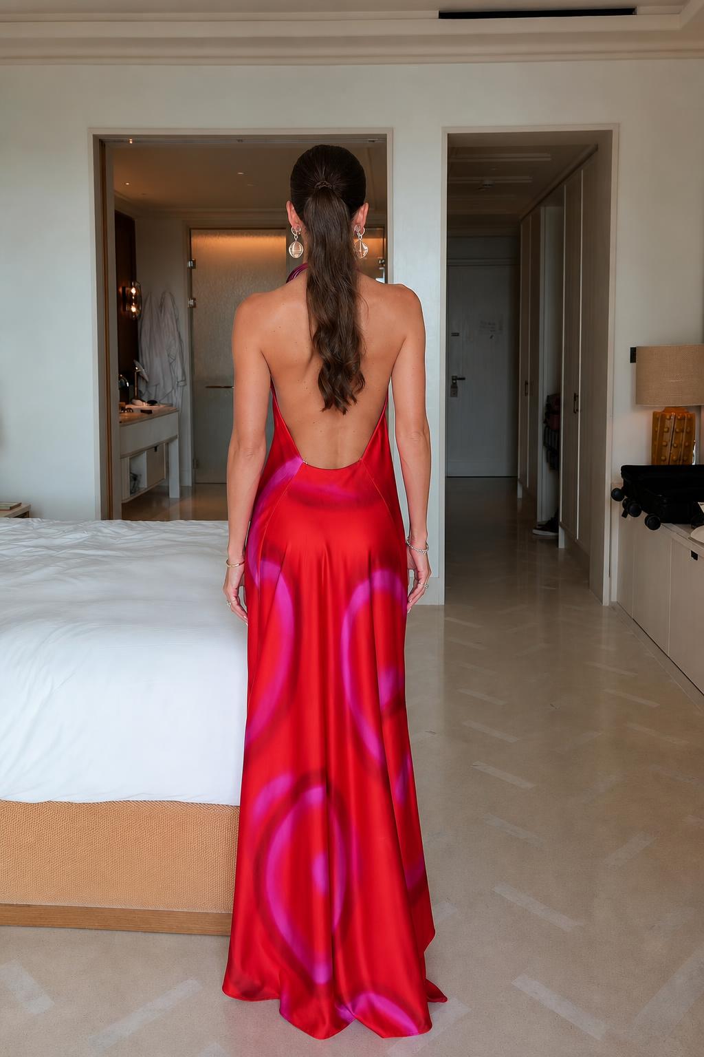 Back view showcasing the open-back design of the halter maxi dress