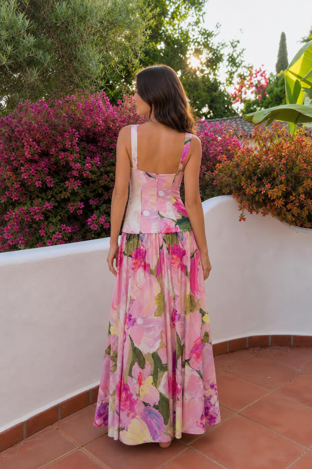 Back view of model showcasing maxi skirt and top