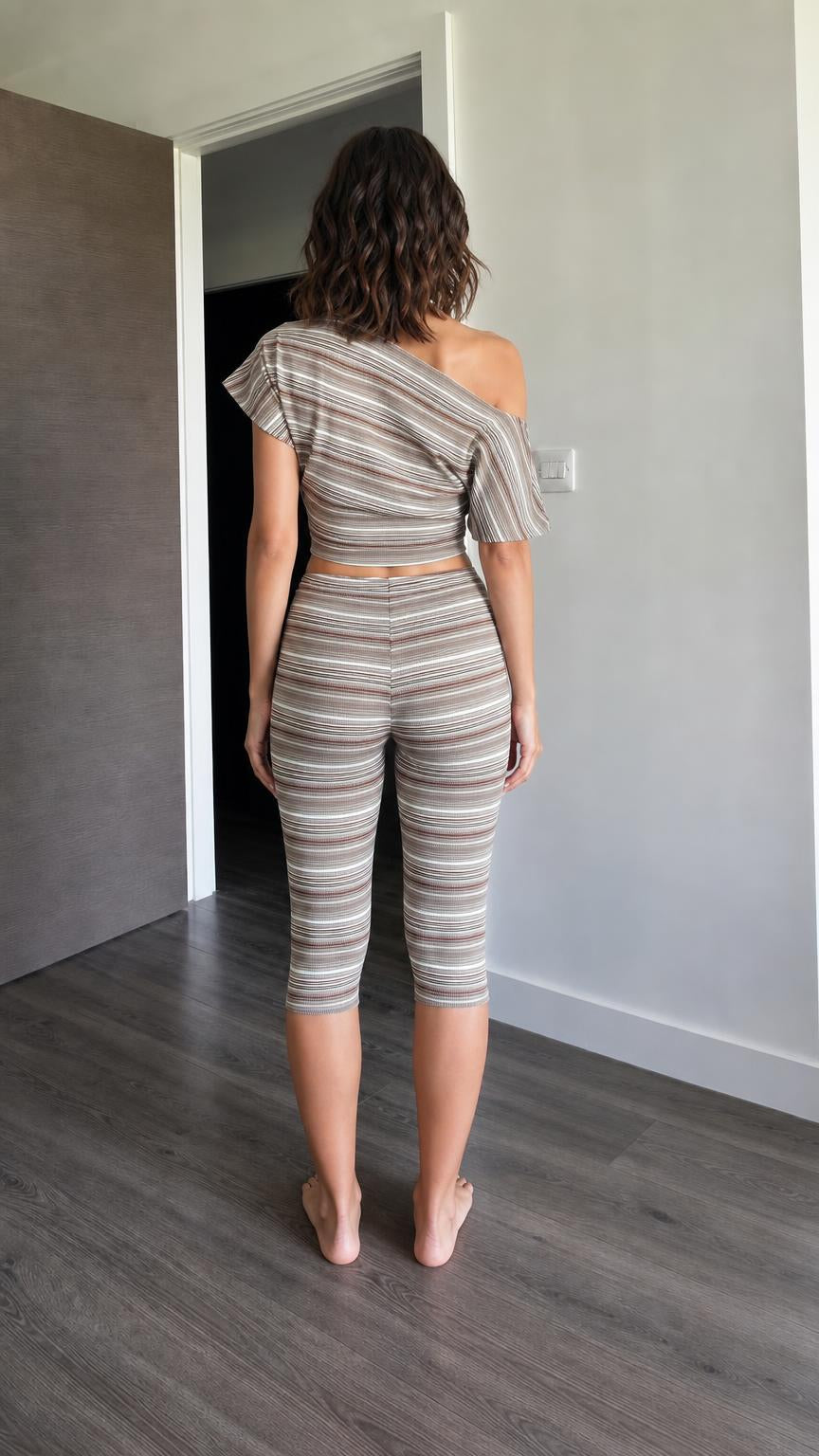 Back view of woman wearing brown striped matching set