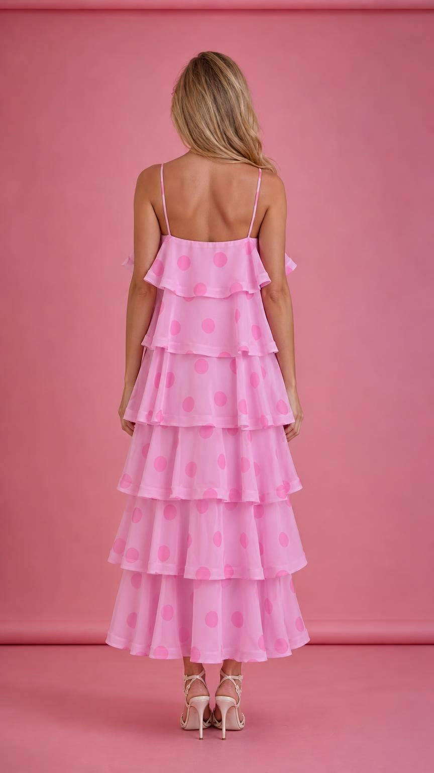 Back view of pink polka dot tiered ruffle midi dress