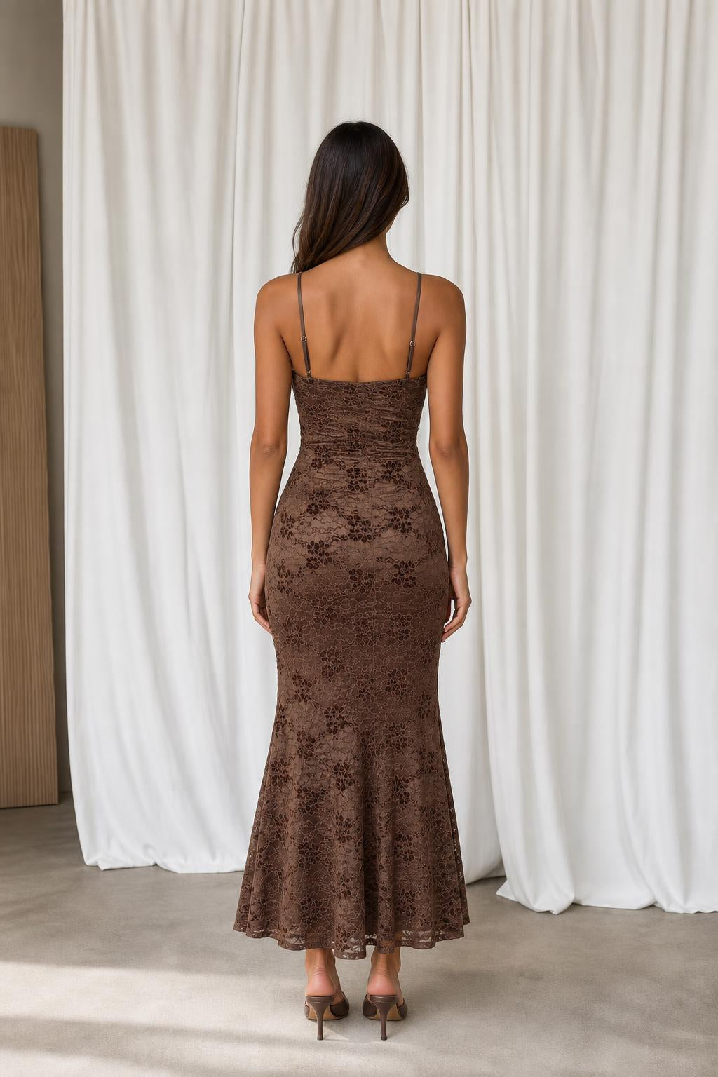 Back view of model showing slim straps and mermaid silhouette
