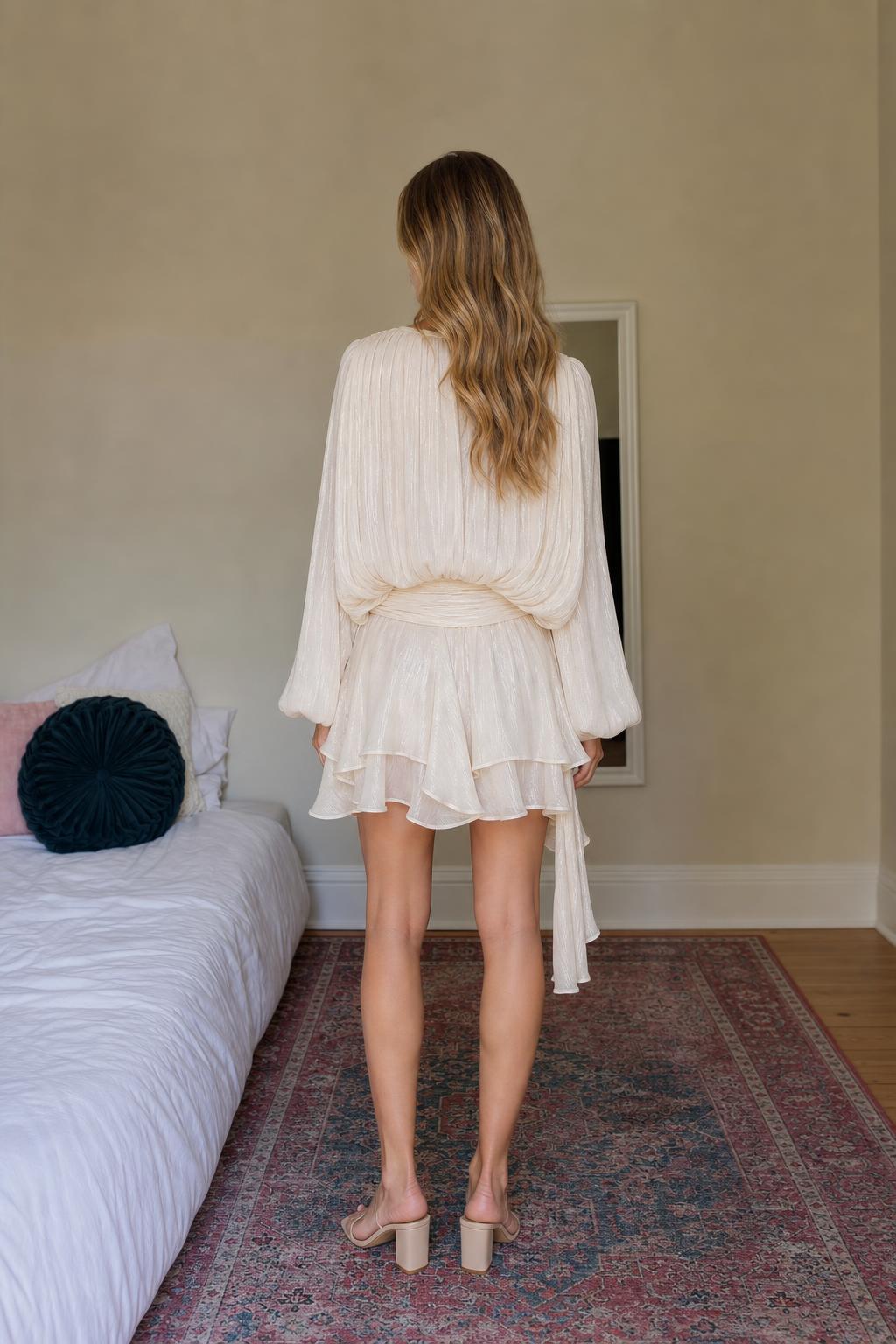Back view of champagne pleated mini dress