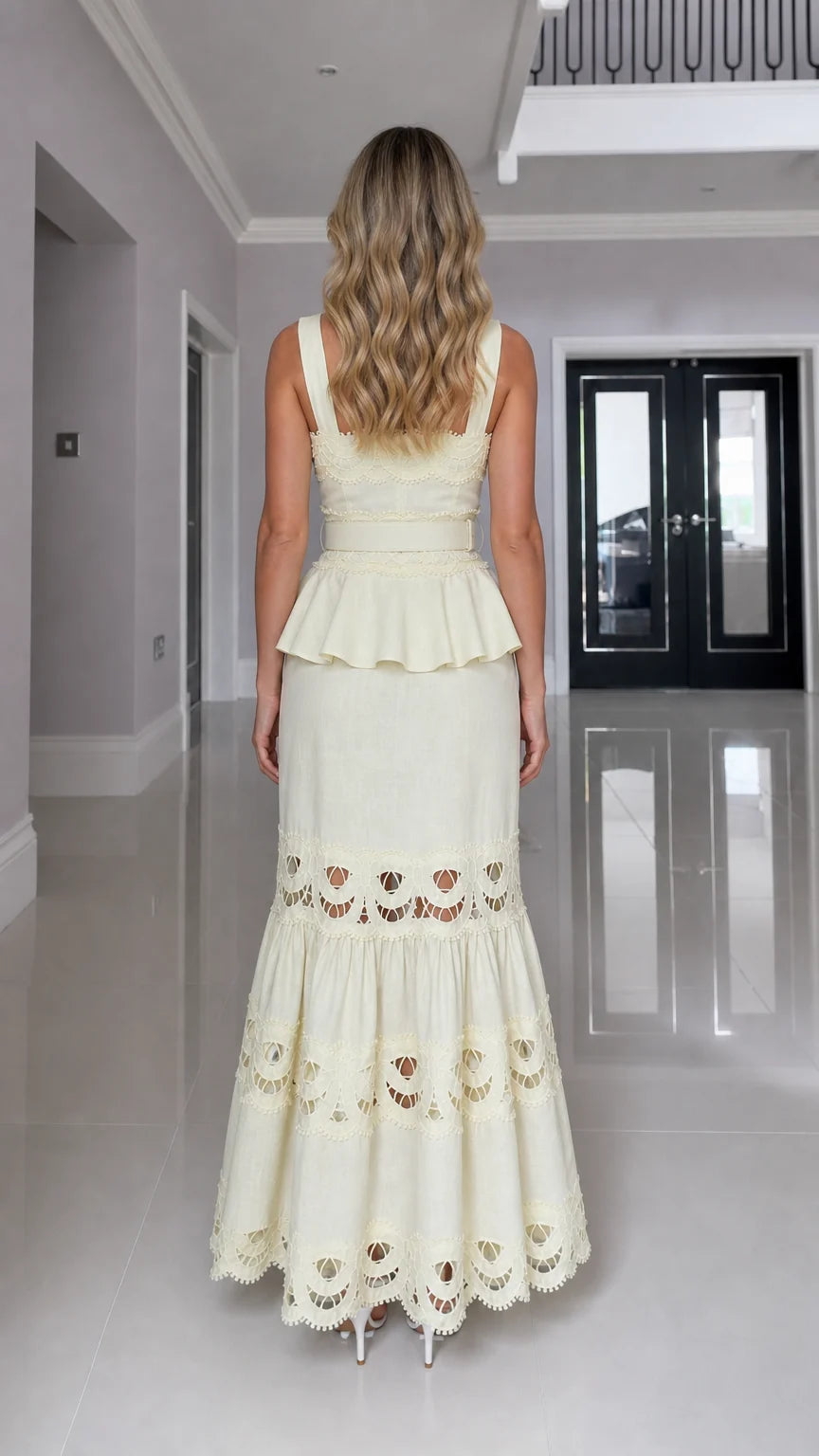 Back view of model in yellow cutout maxi dress