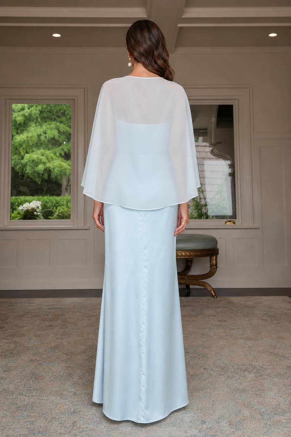 Back view of light blue evening gown with sheer capelet
