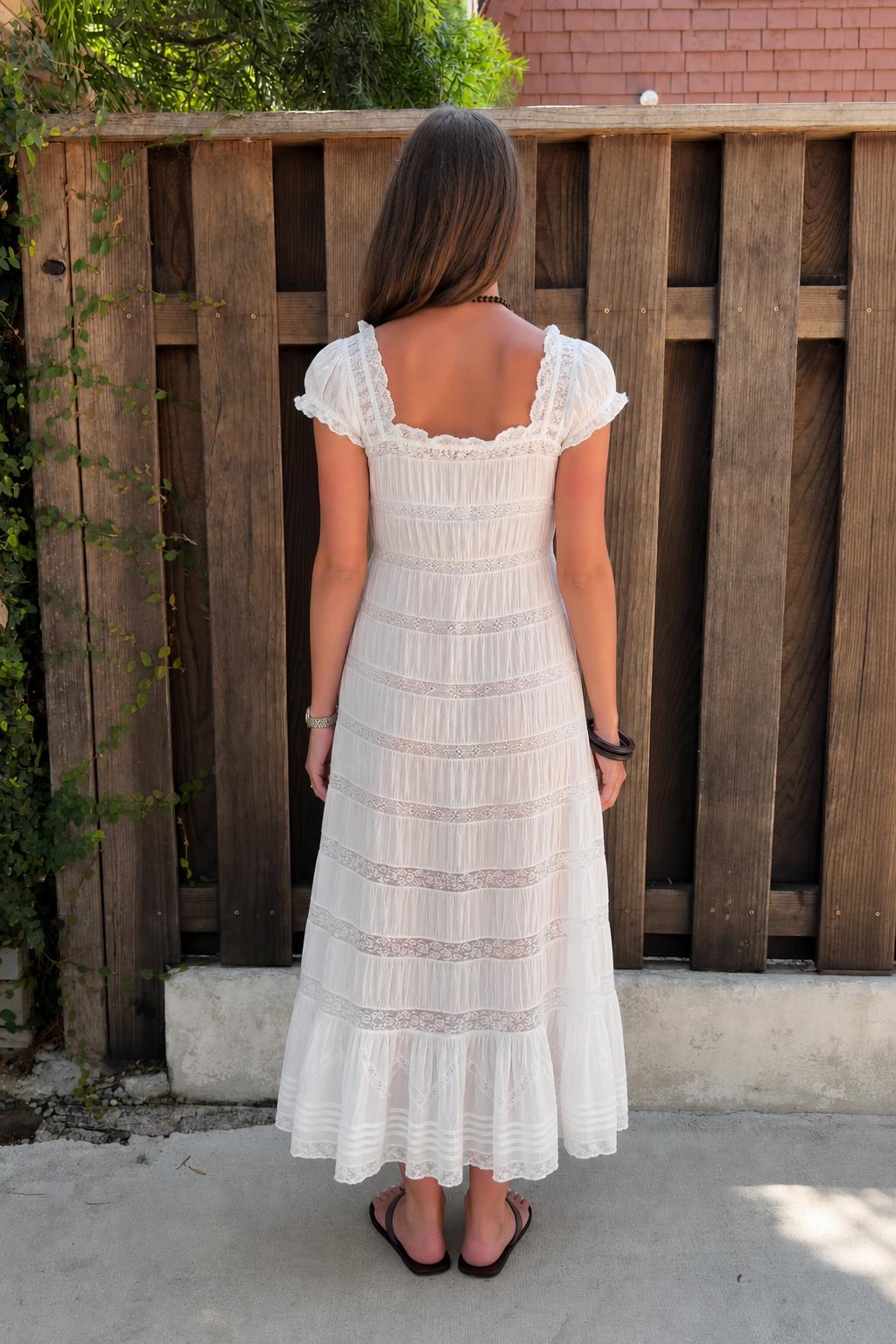 Back view of white lace maxi dress showing square neckline