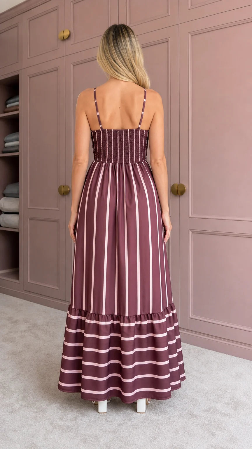 Woman wearing burgundy striped maxi dress back view showing smocked detail