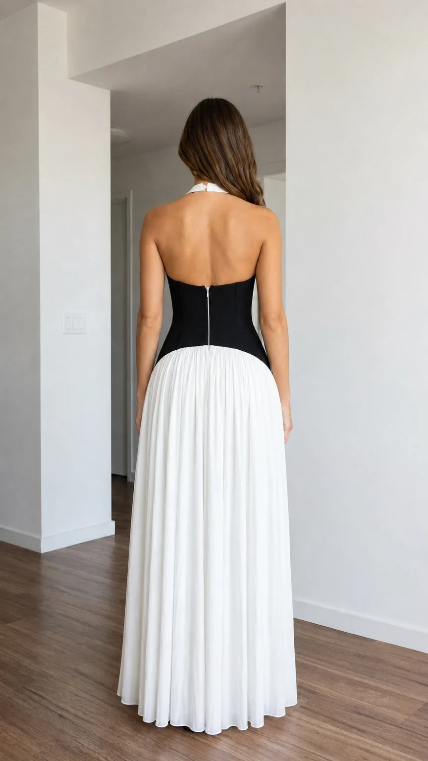 Back view of white halter pleated maxi dress