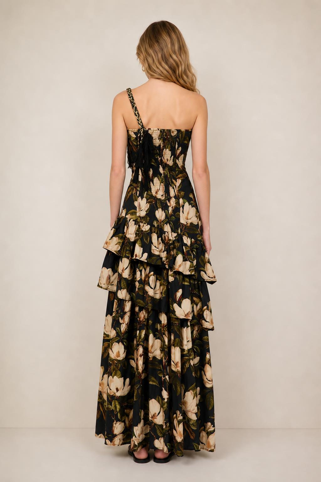 Back view of black floral maxi dress showing tiered ruffles