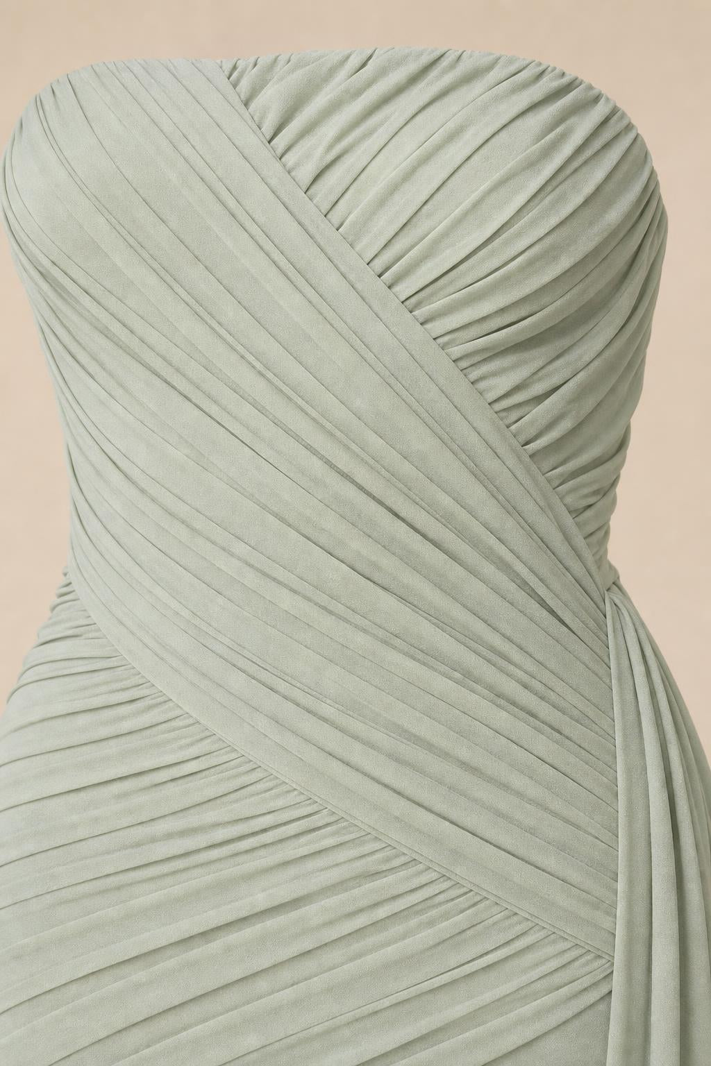 Close-up detail of front bodice ruching and draping in sage green