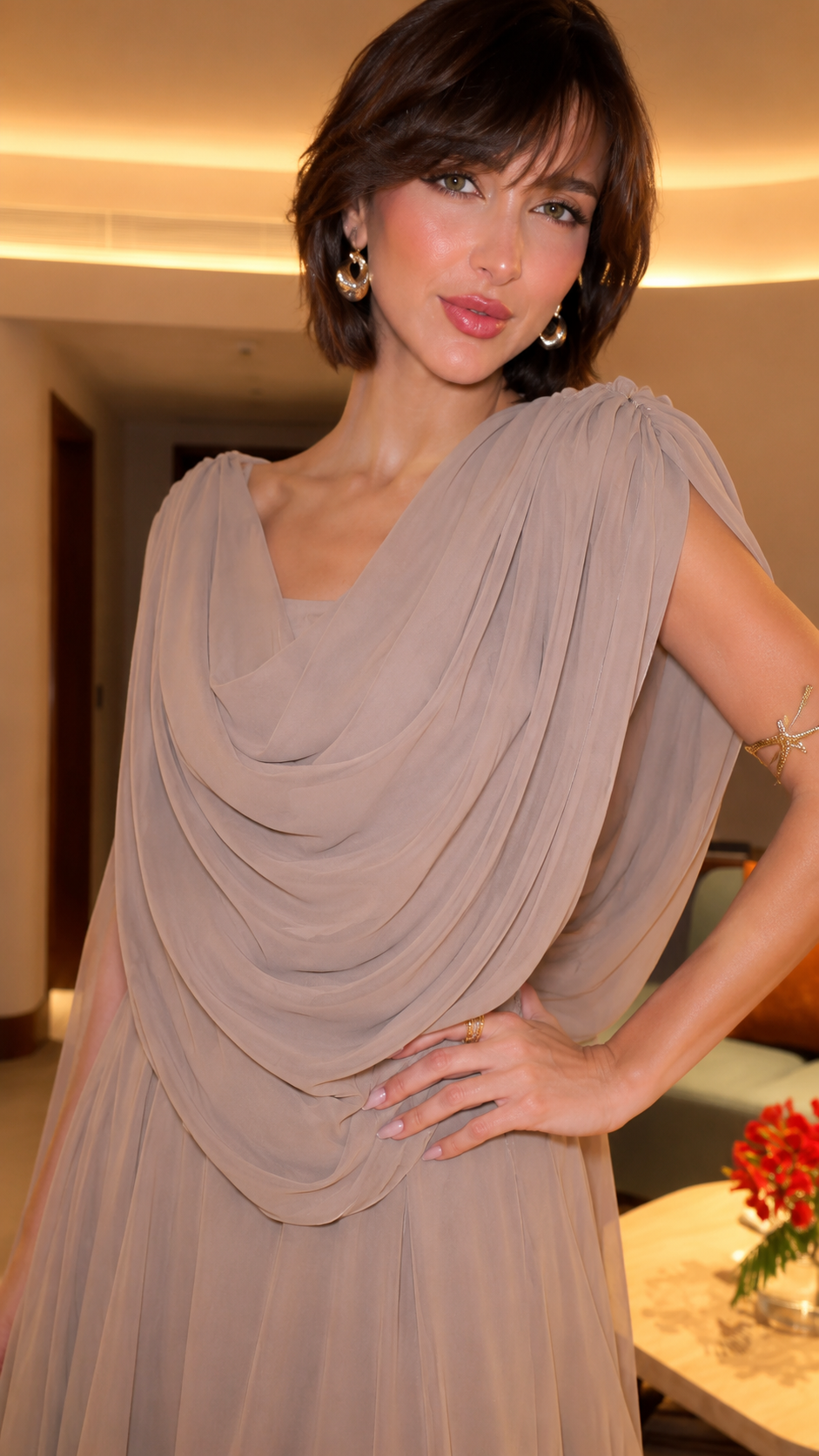Close-up of taupe draped bodice with cowl-style neckline and soft gathered details