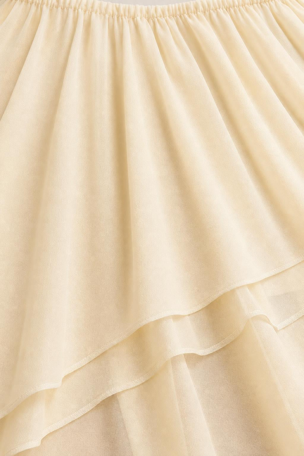 Close-up detail of cream layered chiffon fabric