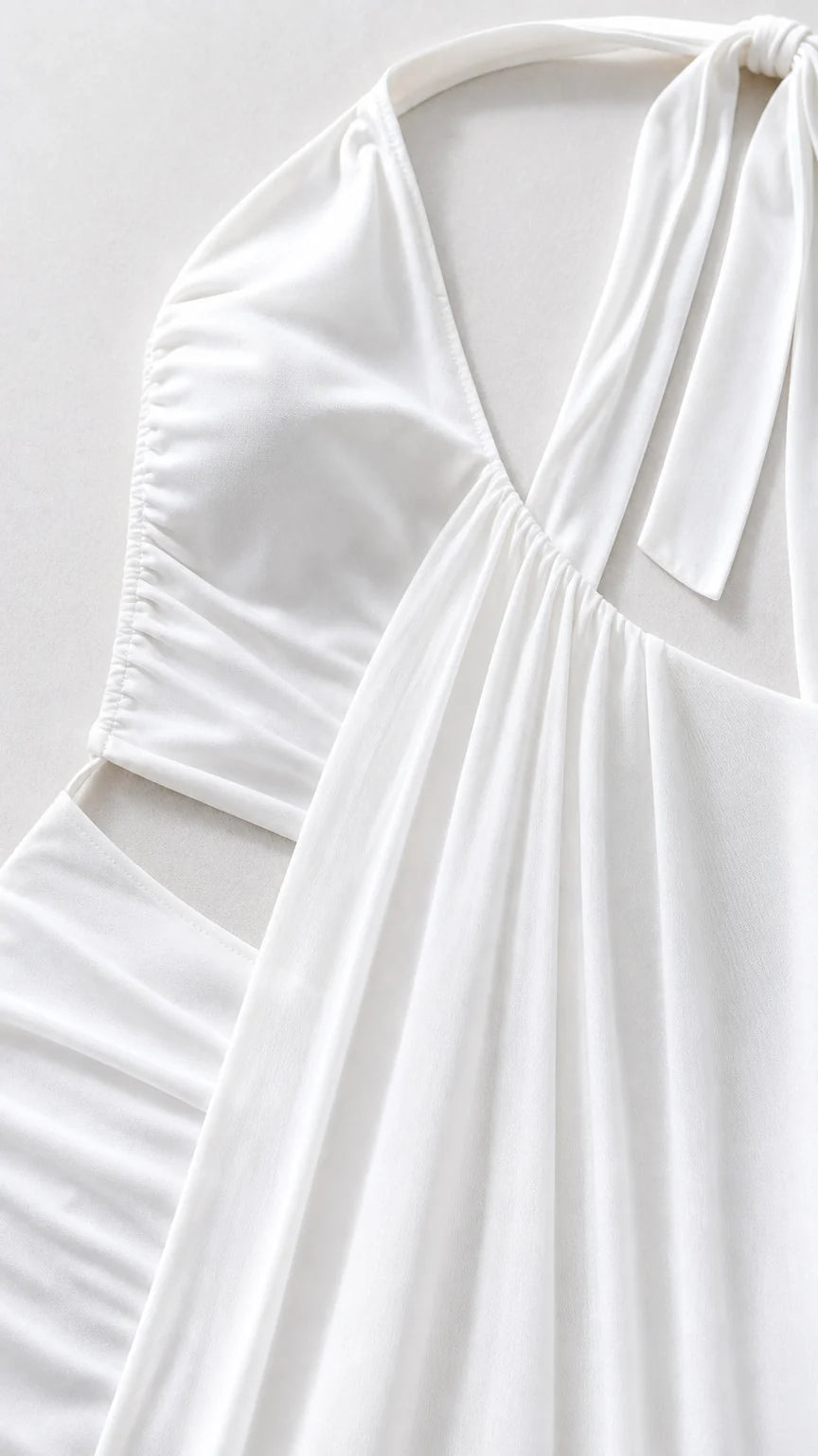 Close-up detail of white fabric, bodice, and cutout construction