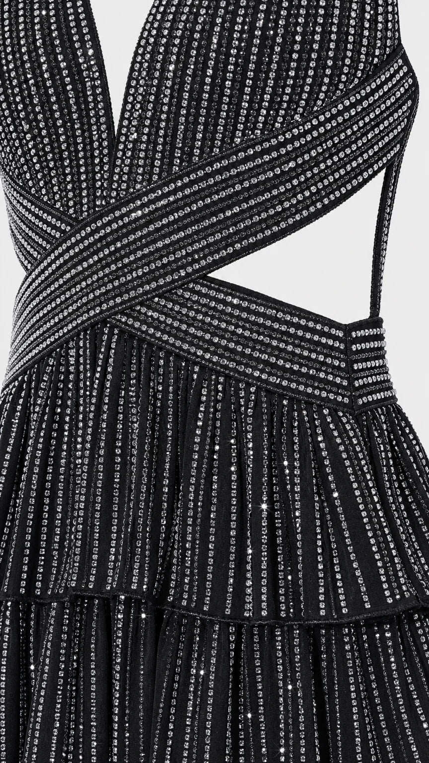 Close-up detail of black glitter crisscross bodice and fabric texture