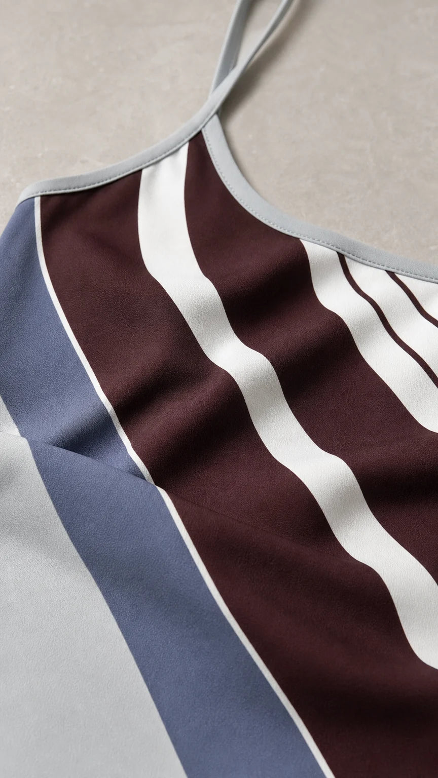 Close-up detail of fabric pattern and spaghetti strap