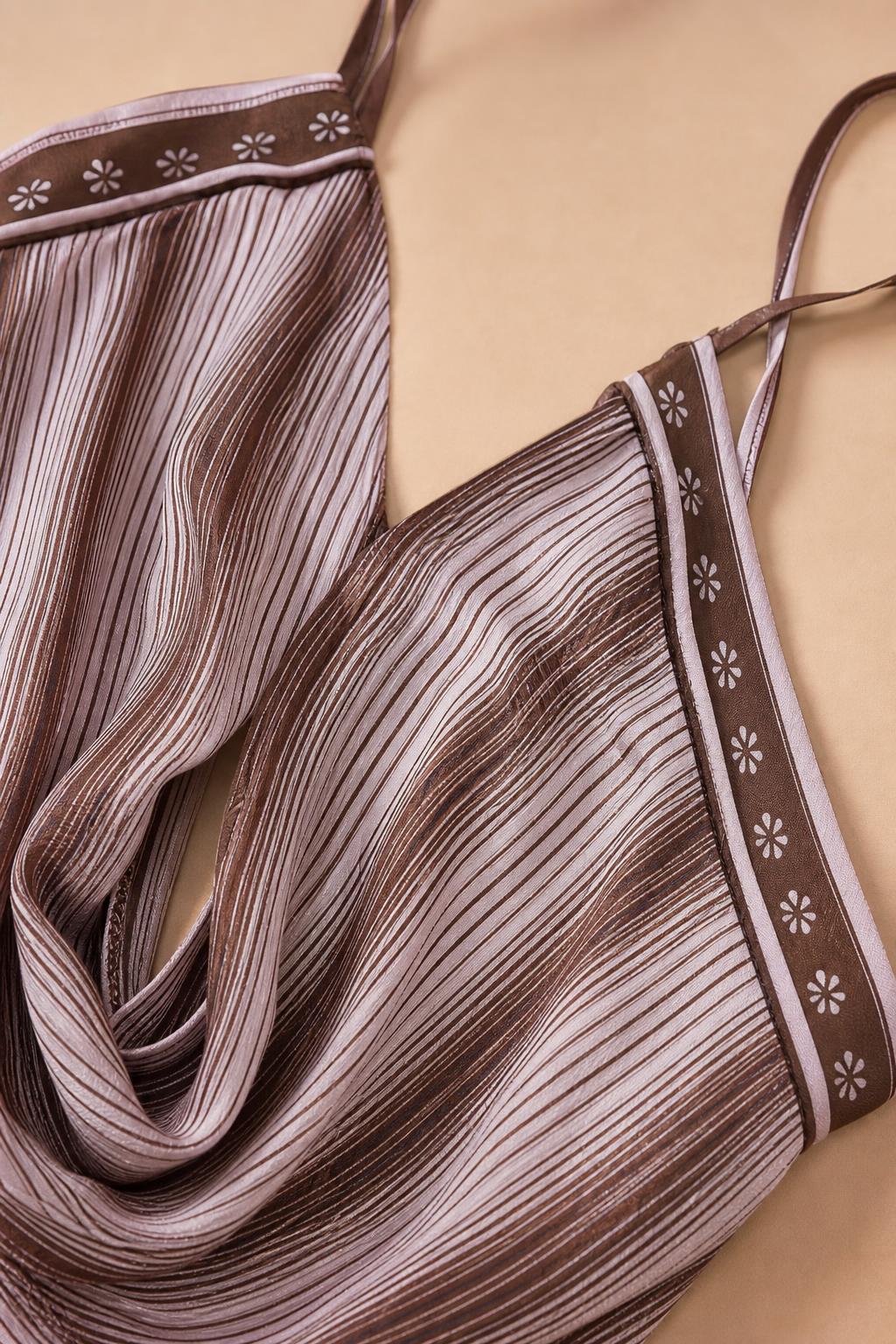 Close-up of the fabric texture and keyhole strap detail