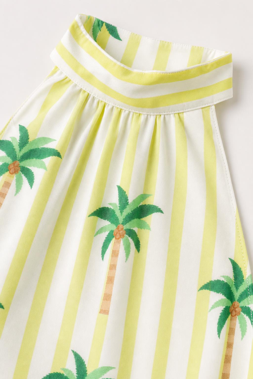 Close-up detail of high neckline and palm tree print fabric