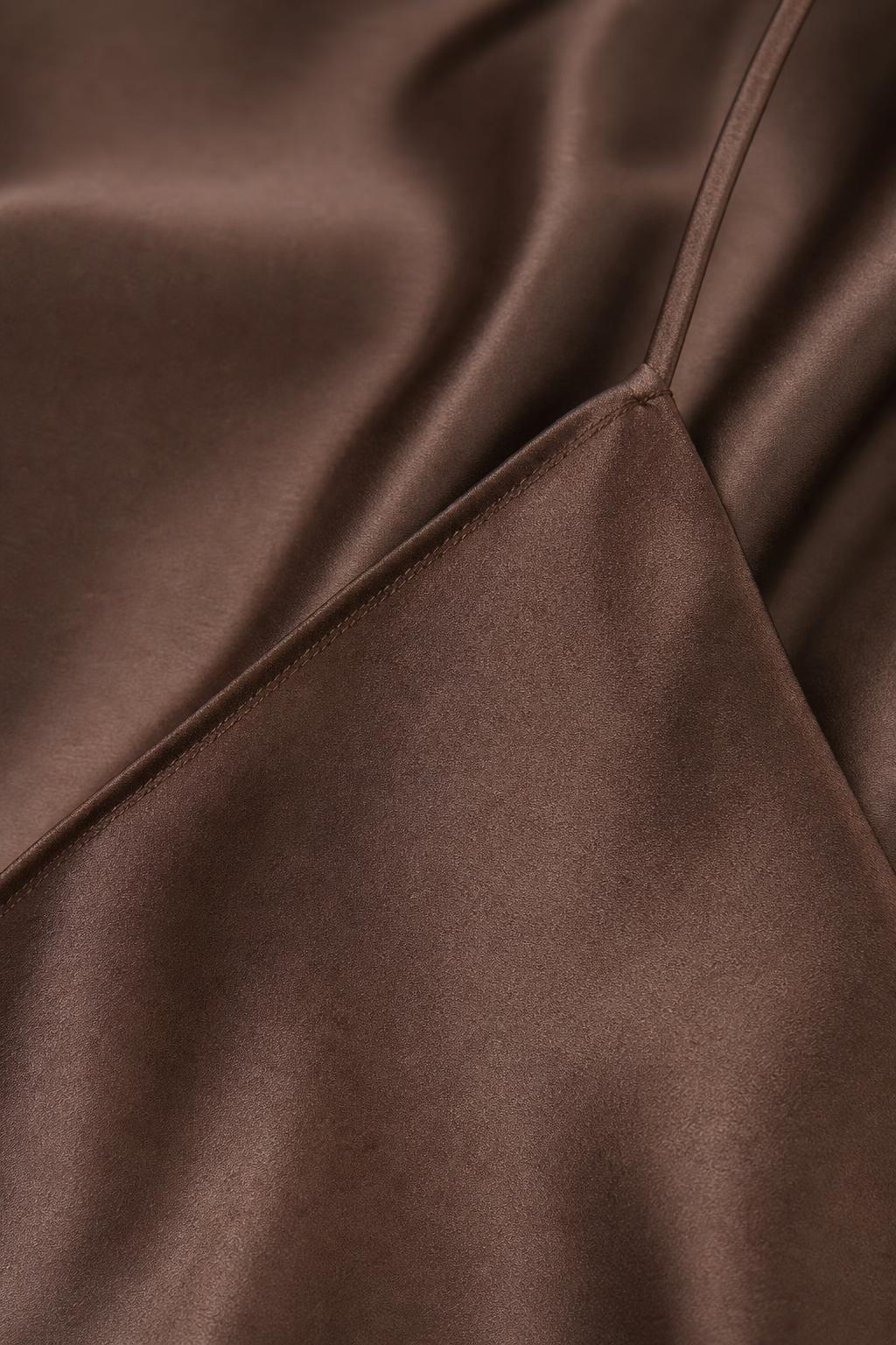 Close-up detail of smooth satin fabric and stitching